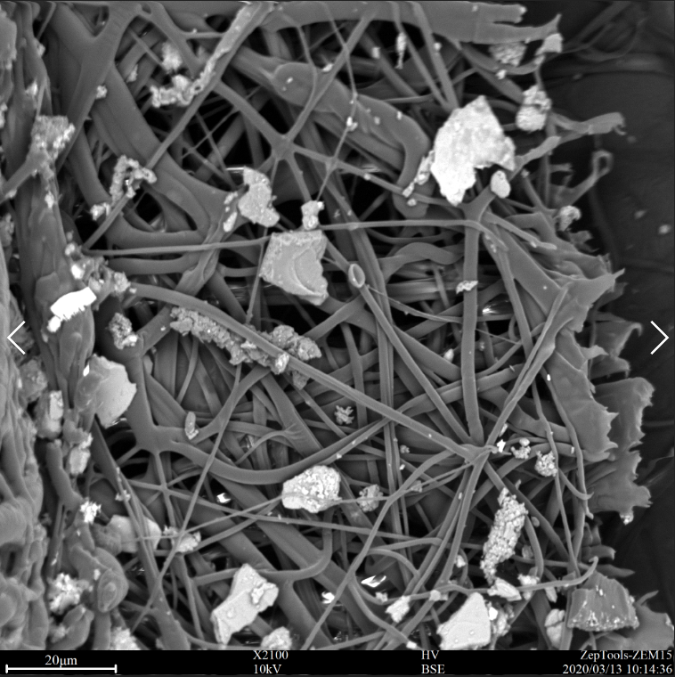 二手煙環境下佩戴過的口罩中間過濾層的掃描電鏡圖片 二手煙環境下佩戴過的口罩中間過濾層的掃描電鏡圖片